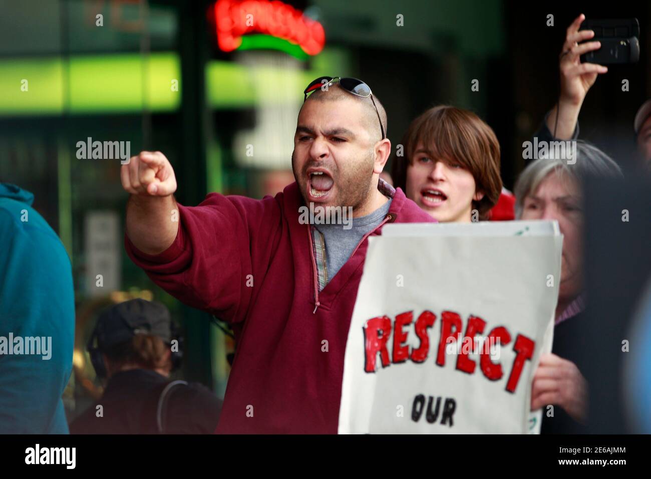 A man chants in protest as federal agents conduct a raid on Oaksterdam University, a cannabis cultivation college, in Oakland, California April 2, 2012. Federal agents raided a cannabis cultivation college on Monday in the San Francisco Bay area widely known as the 'Princeton of Pot' and the 'Harvard of Hemp,' authorities said, as the U.S. government pressed its clamp-down on medical marijuana. REUTERS/Stephen Lam (UNITED STATES - Tags: CRIME LAW DRUGS SOCIETY CIVIL UNREST) Stock Photo