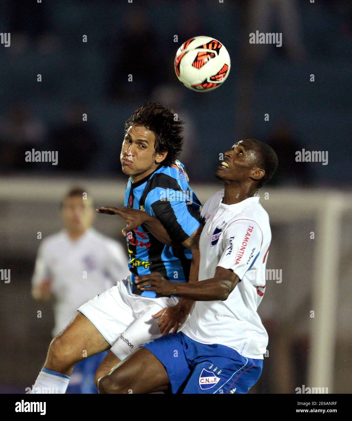 Victor Ferreira L Of Peru S Real Garcilaso Competes For The Ball With Efrain Cortes Of Uruguay S Nacional During Their Copa Libertadores Soccer Match In Montevideo May 9 13 Reuters Andres Stapff Uruguay