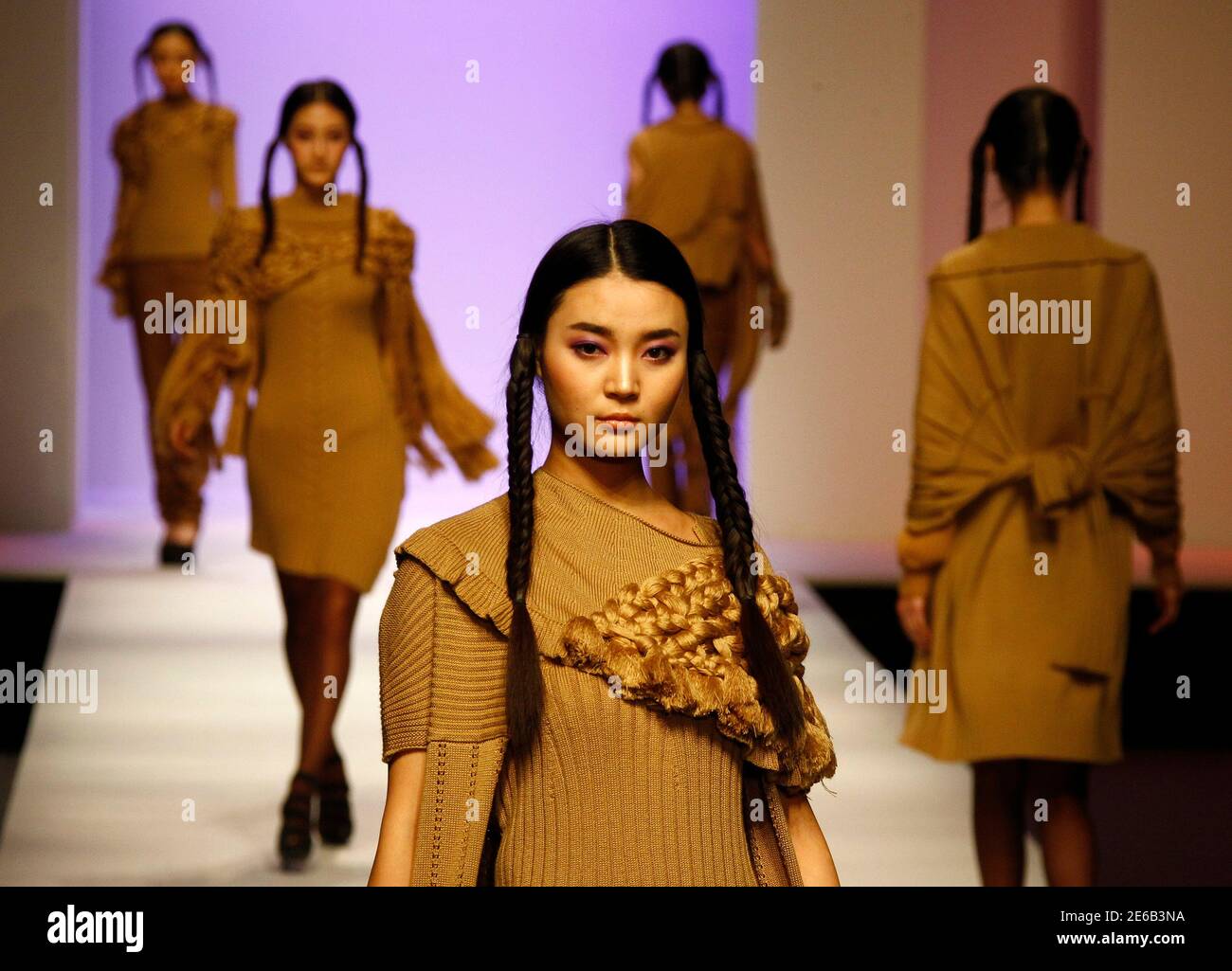 Models present creations at the 2012 China Knitwear Fashion ...