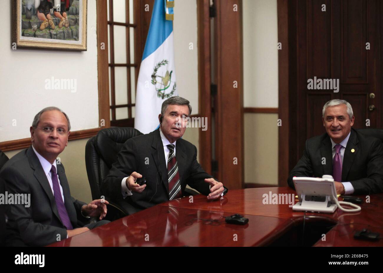 (From L-R) U.S Ambassador to Guatemala Arnold Chacon, Director of the Office of National Drug Control Policy Gil Kerlikowske and Guatemalan President Otto Perez Molina are seen during a meeting in the Presidential House in Guatemala City, June 21, 2012. According to local media, Kerlikowske, who helped reduce cocaine consumption by 40% in the U.S, is in Guatemala to discuss with authorities on strategies to combat the use of the drug in the country. REUTERS/Jorge Dan Lopez (GUATEMALA - Tags: POLITICS CRIME LAW DRUGS SOCIETY) Stock Photo