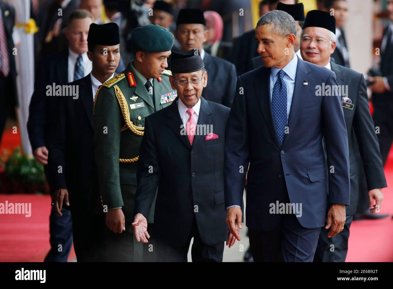 U S President Barack Obama Front R Walks With Malaysia S King Abdul Halim Of Kedah Front L As They Participate In A Welcoming Ceremony In Parliament Square In Kuala Lumpur April 26 2014