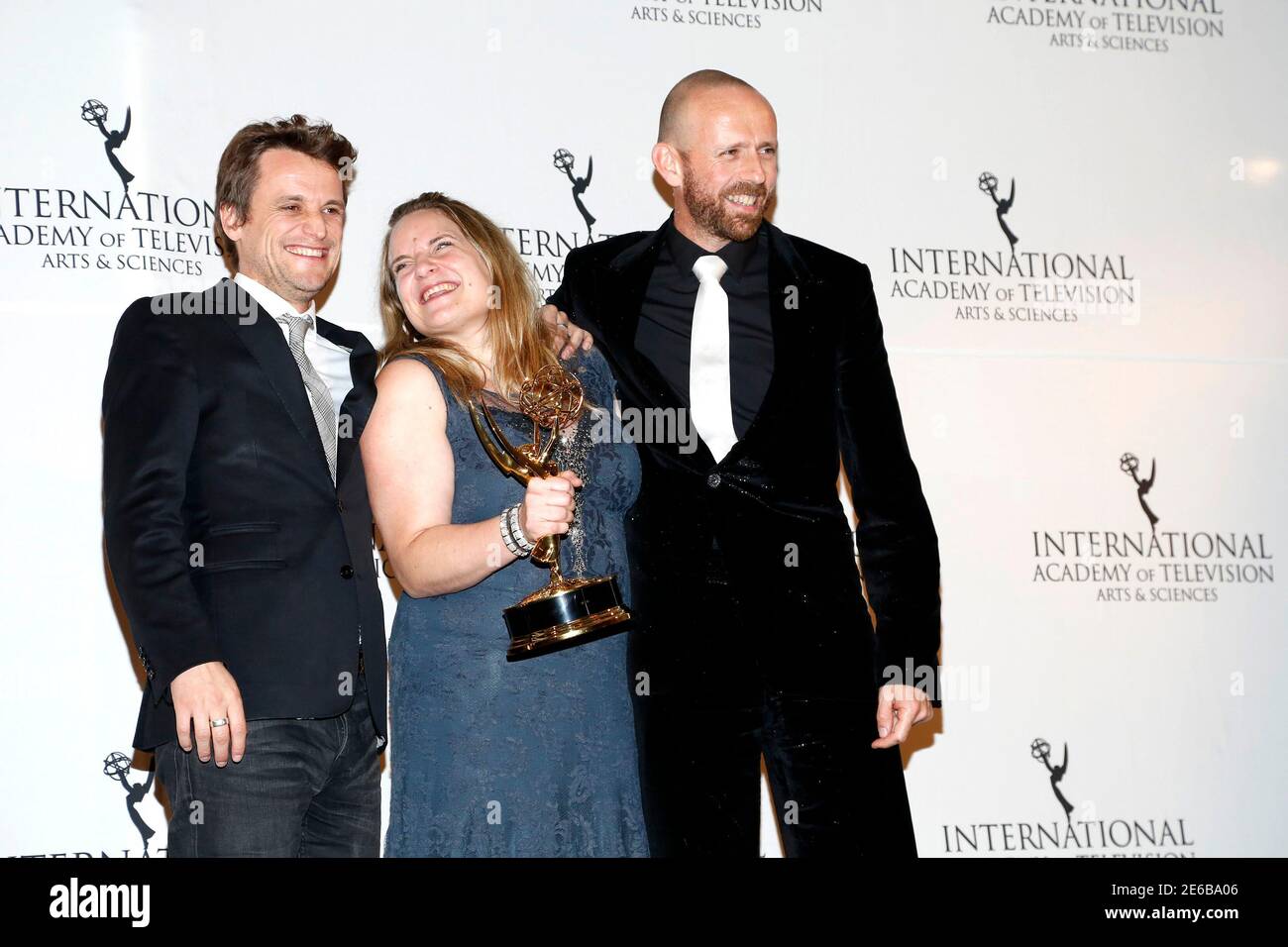 L-R) Comedy Award recipients Tim Van Aelst, Ruth Beeckmans and Gunther  Lesage from the series "What if? 2" celebrate backstage at the 42nd  International Emmy Awards in New York November 24, 2014.