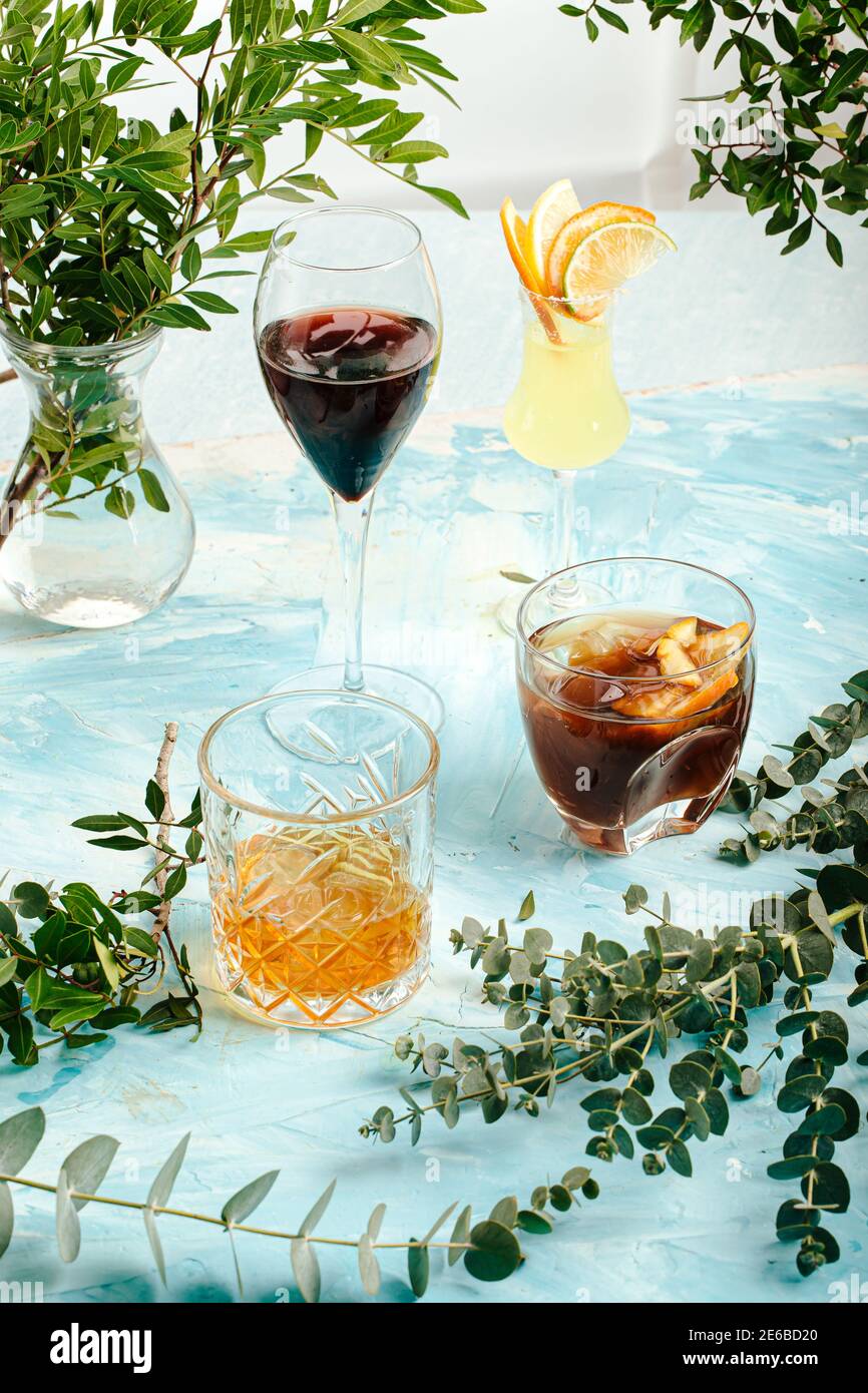 Assorted variety of different cocktails on blue Stock Photo