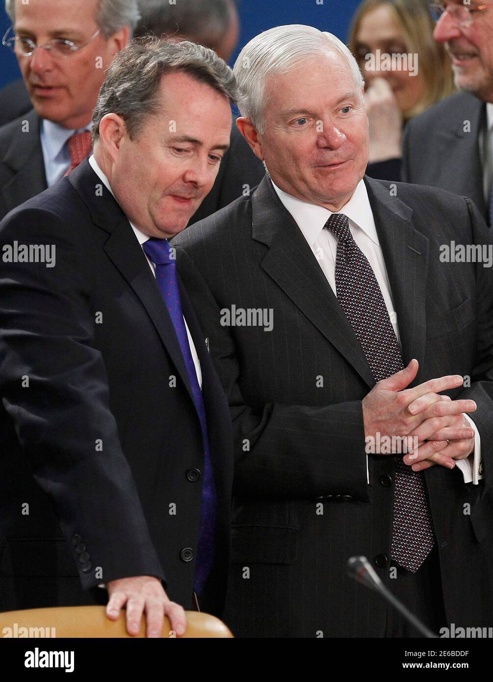 Britain's Defence Secretary Liam Fox (L) talks with U.S. Defense Secretary Robert Gates (R) at a NATO defence ministers meeting (NAC) at the Alliance headquarters in Brussels March 10, 2011. NATO defence ministers meeting in Brussels on Thursday and Friday will discuss options to respond to the turmoil in Libya, including a possible no-fly zone, the officials said.      REUTERS/Yves Herman (BELGIUM - Tags: POLITICS CIVIL UNREST MILITARY) Stock Photo