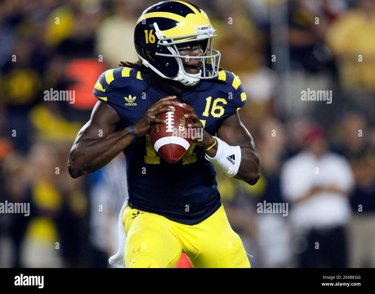 Michigan quarterback Denard Robinson looks for his receiver during the  first half of their NCAA college football game against Notre Dame in Ann  Arbor, Michigan September 10, 2011. Both teams wore throw