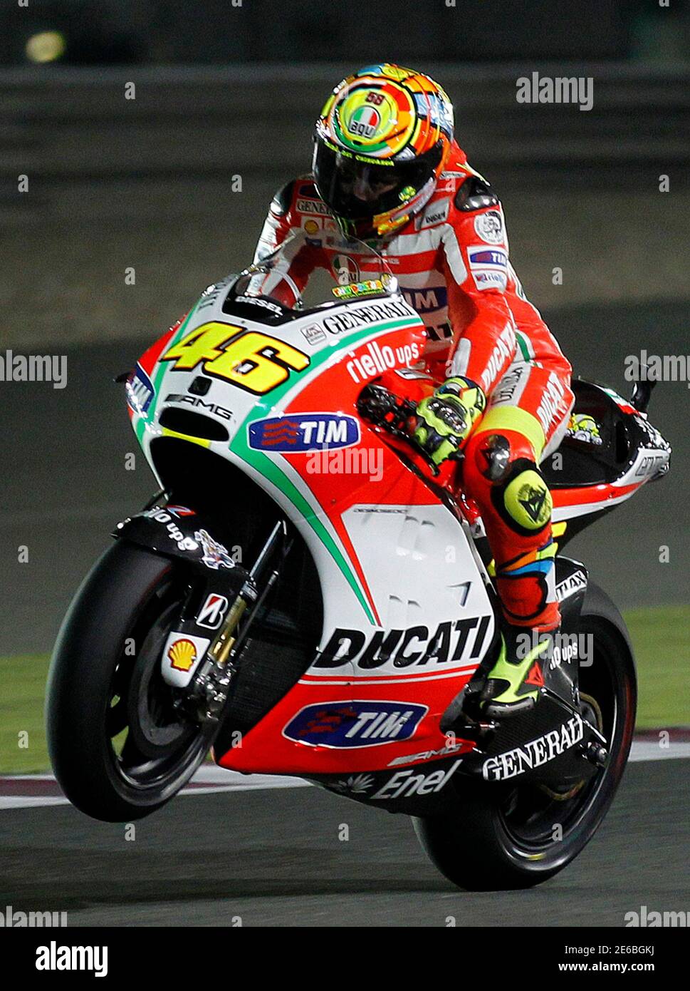 Ducati MotoGP rider Valentino Rossi of Italy does a wheelie during a free  practice session of the Qatar MotoGP Grand Prix at the Losail International  circuit in Doha April 6, 2012. REUTERS/Mohammed