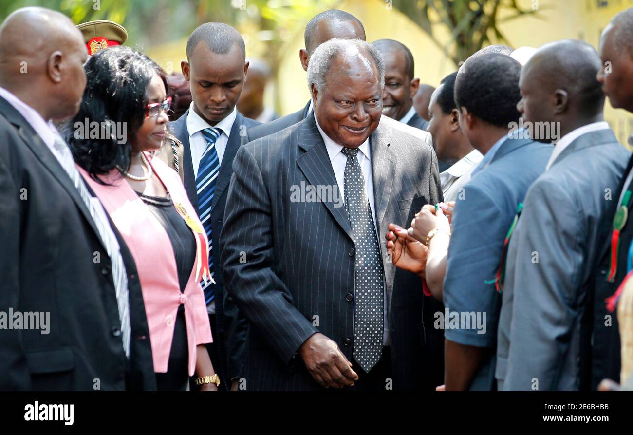 Kenya's President Mwai Kibaki (C) meets government officials upon arriving at the Mombasa International Show in the Kenyan coastal city of Mombasa, August 30, 2012. The killing of a Muslim cleric Aboud Rogo, accused by the United States of helping al Qaeda-linked Islamist militants in Somalia, triggered riots and violence in which five people, including three police officers, were killed. REUTERS/Thomas Mukoya (KENYA - Tags: RELIGION CIVIL UNREST CRIME LAW POLITICS) Stock Photo