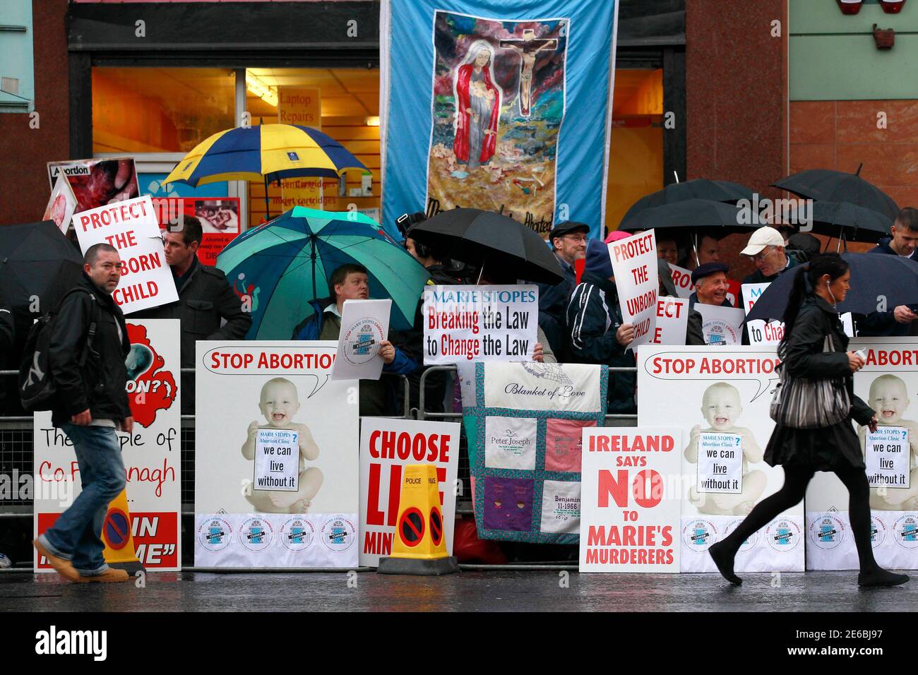 Pro-life campaigners protest outside the Marie Stopes clinic in Belfast October 18, 2012. The first private clinic offering abortions opened in Northern Ireland on Thursday, making access to abortion much easier for women in both Northern Ireland and the Republic of Ireland.    REUTERS/Cathal McNaughton   (NORTHERN IRELAND - Tags: HEALTH SOCIETY) Stock Photo