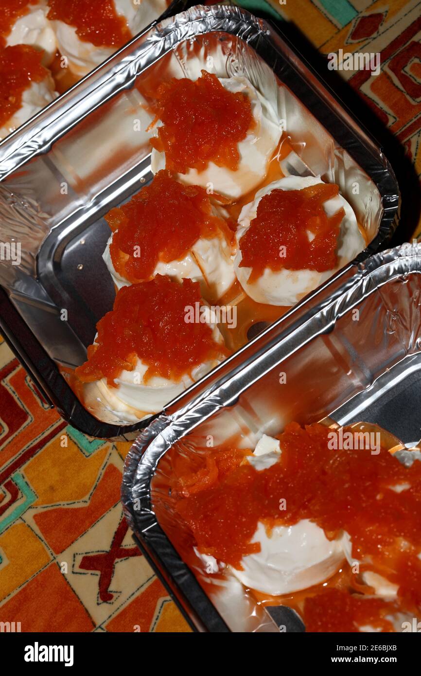 Greek yogurt dessert with sweet carrot in aluminum box to go take away macro background modern