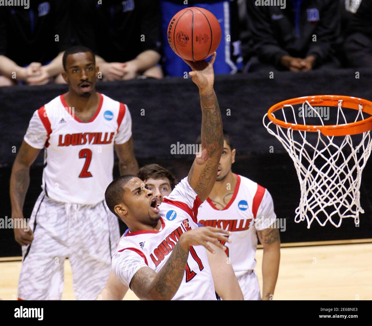 Louisville Cardinals forward Chane Behanan (21) scores ...