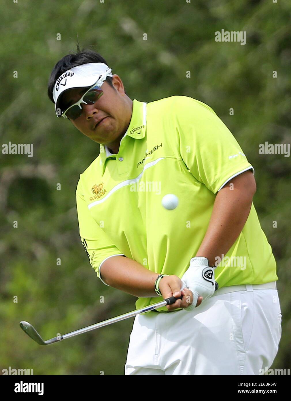 Kiradech Aphibarnrat of Thailand plays a shot on the 13th hole during the  Nedbank Challenge at Sun City December 7, 2014. Briton Danny Willett landed  six birdies and the biggest win of