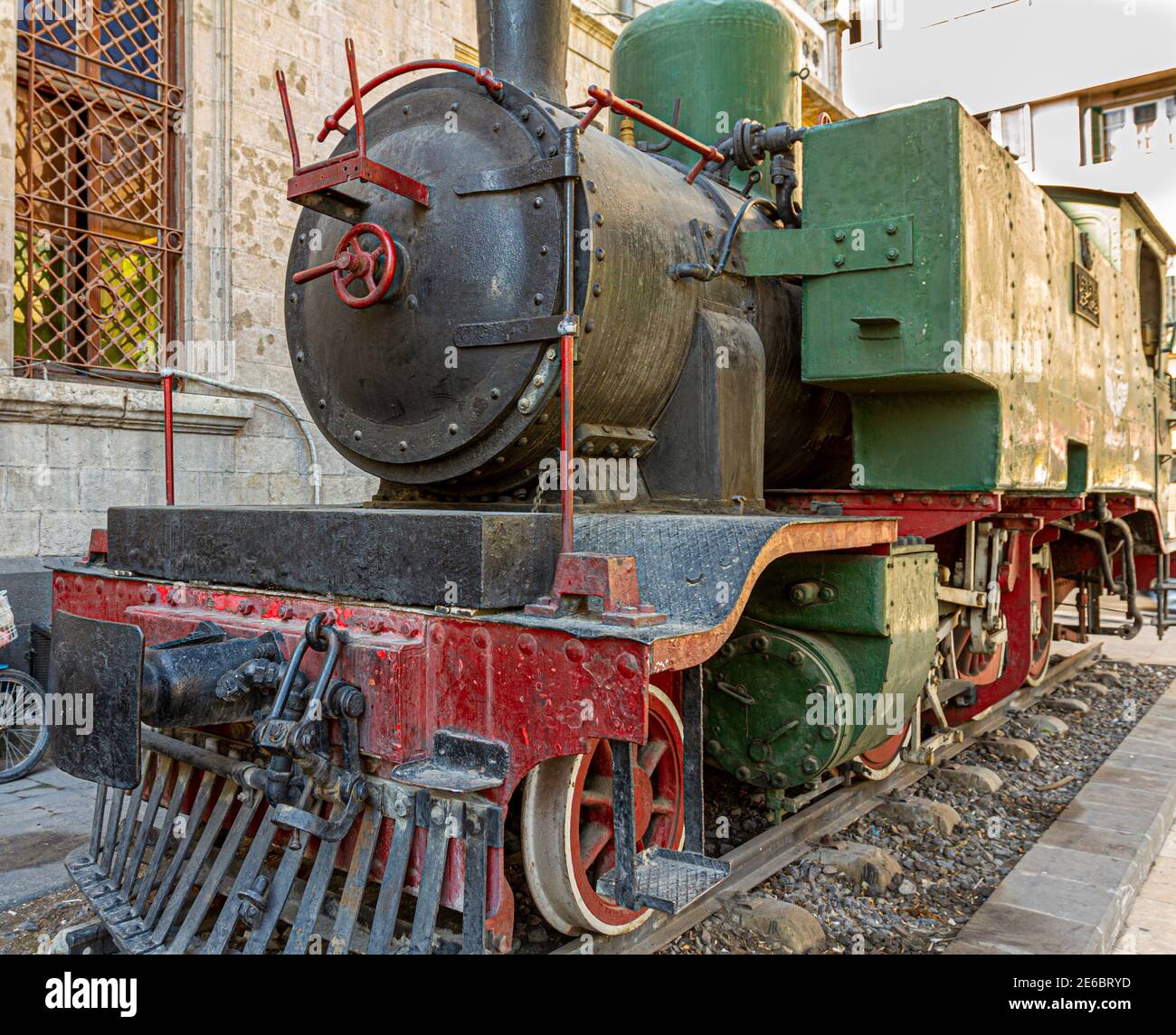 Historic locomotive dating back to 19th century seen on display in front of the famous former Hejaz Railway Station in Damascus, Syria. This station p Stock Photo
