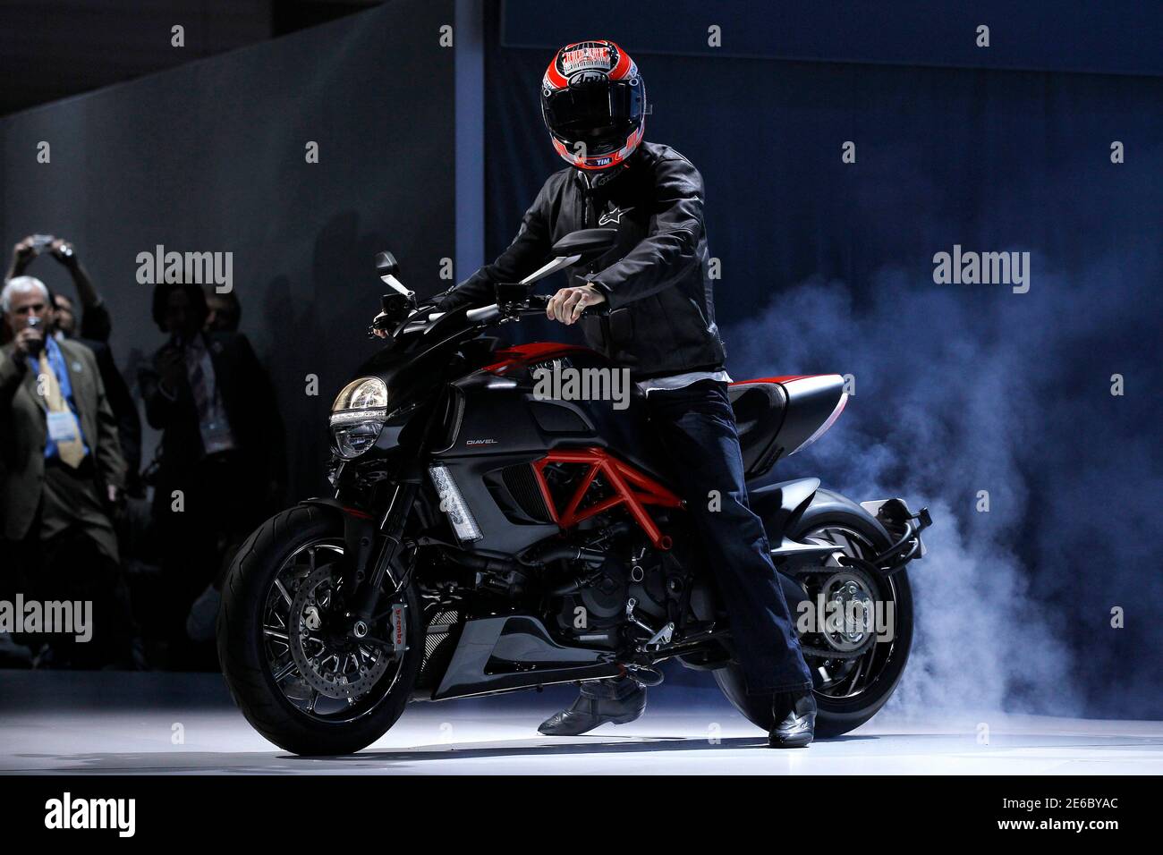 Professional motorcycle racer Nicky Hayden rides a Ducati Diavel Carbon at the LA Auto Show in Los Angeles November 17, 2010.  REUTERS/Mario Anzuoni (UNITED STATESBUSINESS TRANSPORT - Tags: TRANSPORT BUSINESS SPORT MOTOR RACING) Stock Photo