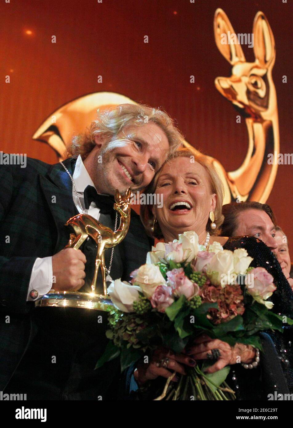 German Entertainer Thomas Gottschalk L Poses With Actress Ruth Maria Kubitschek After He Received The Trophy For Best Tv Event Of The Year During The 63rd Bambi Media Awards Ceremony In Wiesbaden