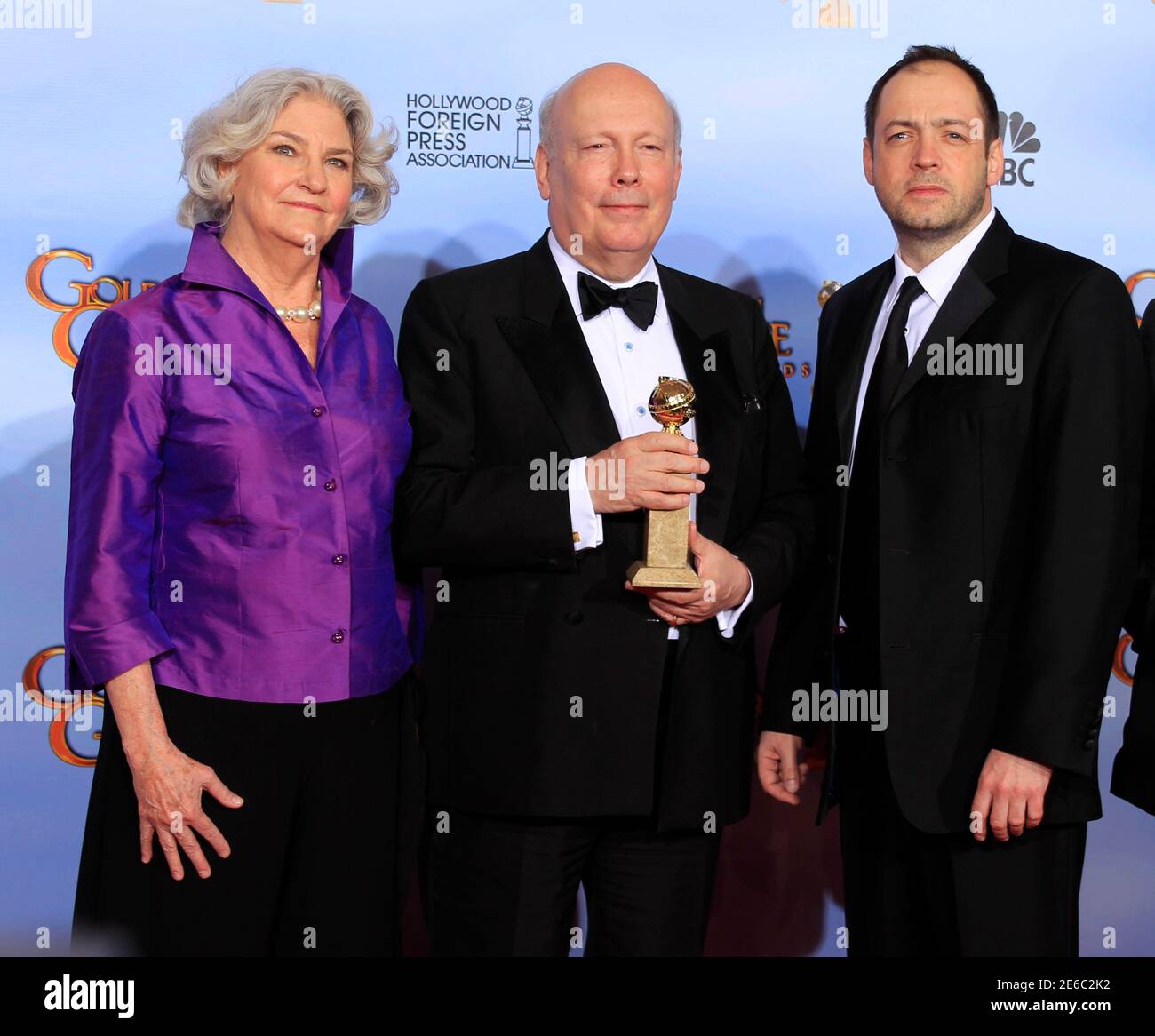 Producer Rebecca Eaton L Writer Producer Julian Fellowes And Producer Gareth Neame R From Downton Abbey Winner Of Best Television Mini Series Or Motion Picture Pose With Their Award At The 69th Annual Golden