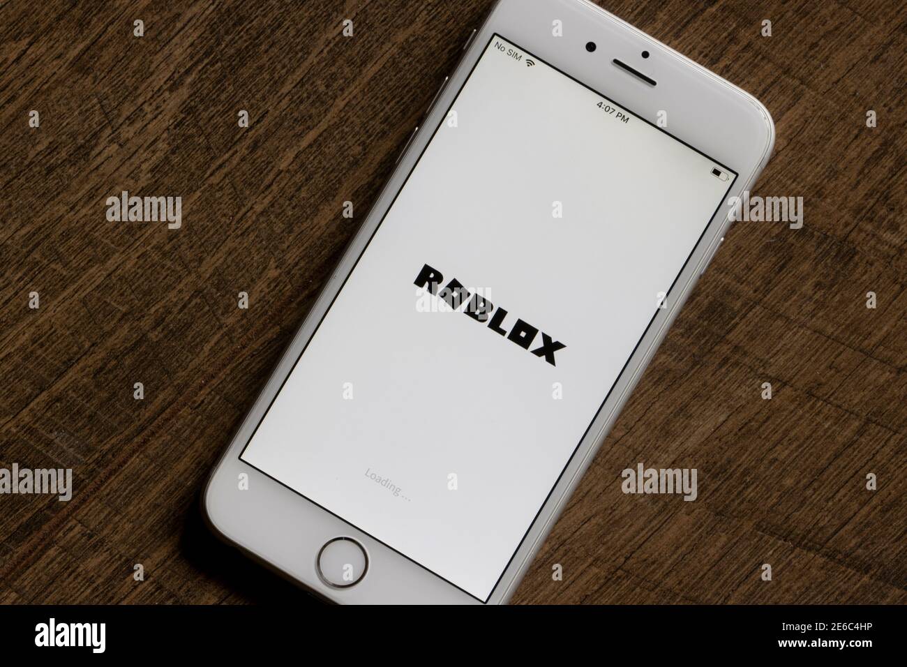 In this photo illustration the Roblox logo is seen on a smartphone screen  in front of Roblox website. (Photo by Pavlo Gonchar / SOPA Images/Sipa USA  Stock Photo - Alamy