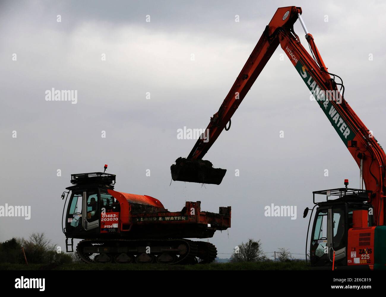 Dredging work on the River Parrett begins at Burrowbridge, after floods caused months of disruption in the coastal region of the Somerset Levels, in southwest England March 31, 2014. REUTERS/Luke MacGregor (BRITAIN - Tags: ENVIRONMENT BUSINESS CONSTRUCTION) Stock Photo