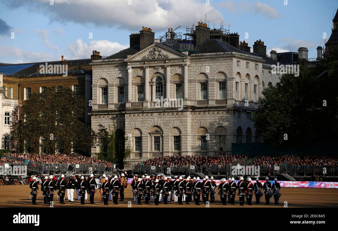 Musicians of the Royal Marines, the 2nd Marine Division Band, United States Marine Corps and the Royal Netherlands Marine Corps Band perform in the largest 'Beating Retreat' military pageant in front of Britain's Prince Philip, which is also attended by Queen Elizabeth, at the Horse Guards Parade in London June 4,  2014. A total of 490 military personnel and musicians performed in the annual 'Beating Retreat' this year to celebrate the 350th anniversary of the Royal Marines. REUTERS/Luke MacGregor (BRITAIN - Tags: MILITARY ROYALS ANNIVERSARY) Stock Photo