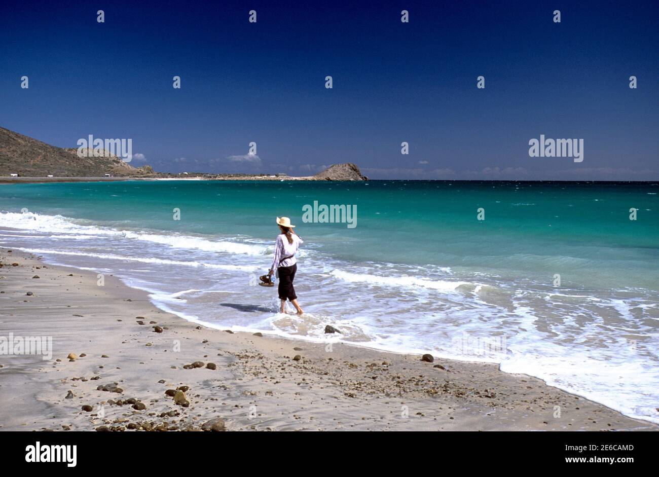 Woman walking on beach near Cabo Pulmo, Baja California Sur, Mexico Stock Photo