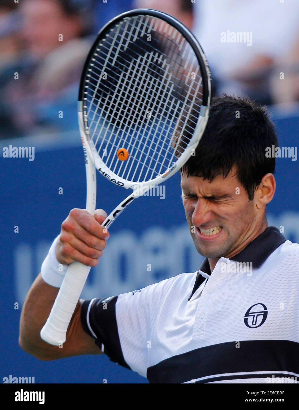 Novak Djokovic of Serbia reacts to a missed shot during his match against  Roger Federer of Switzerland during the U.S. Open tennis tournament in New  York September 11, 2010. REUTERS/Eduardo Munoz (UNITED