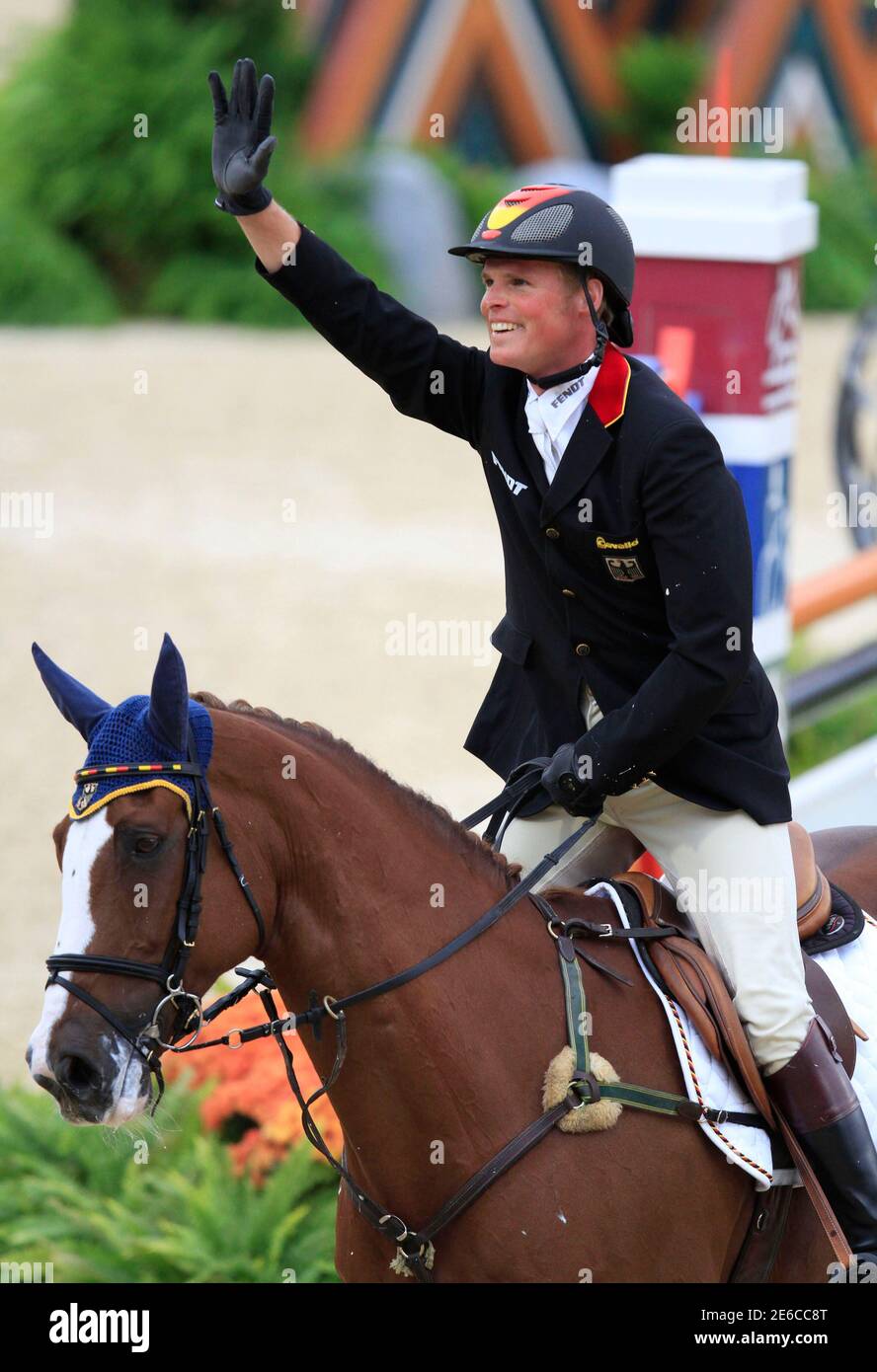 Frank Ostholt of Germany riding Mr. Medicott waves to the crowd after  competing in the show jumping phase of the Eventing World Championship at  the World Equestrian Games in Lexington, Kentucky, October
