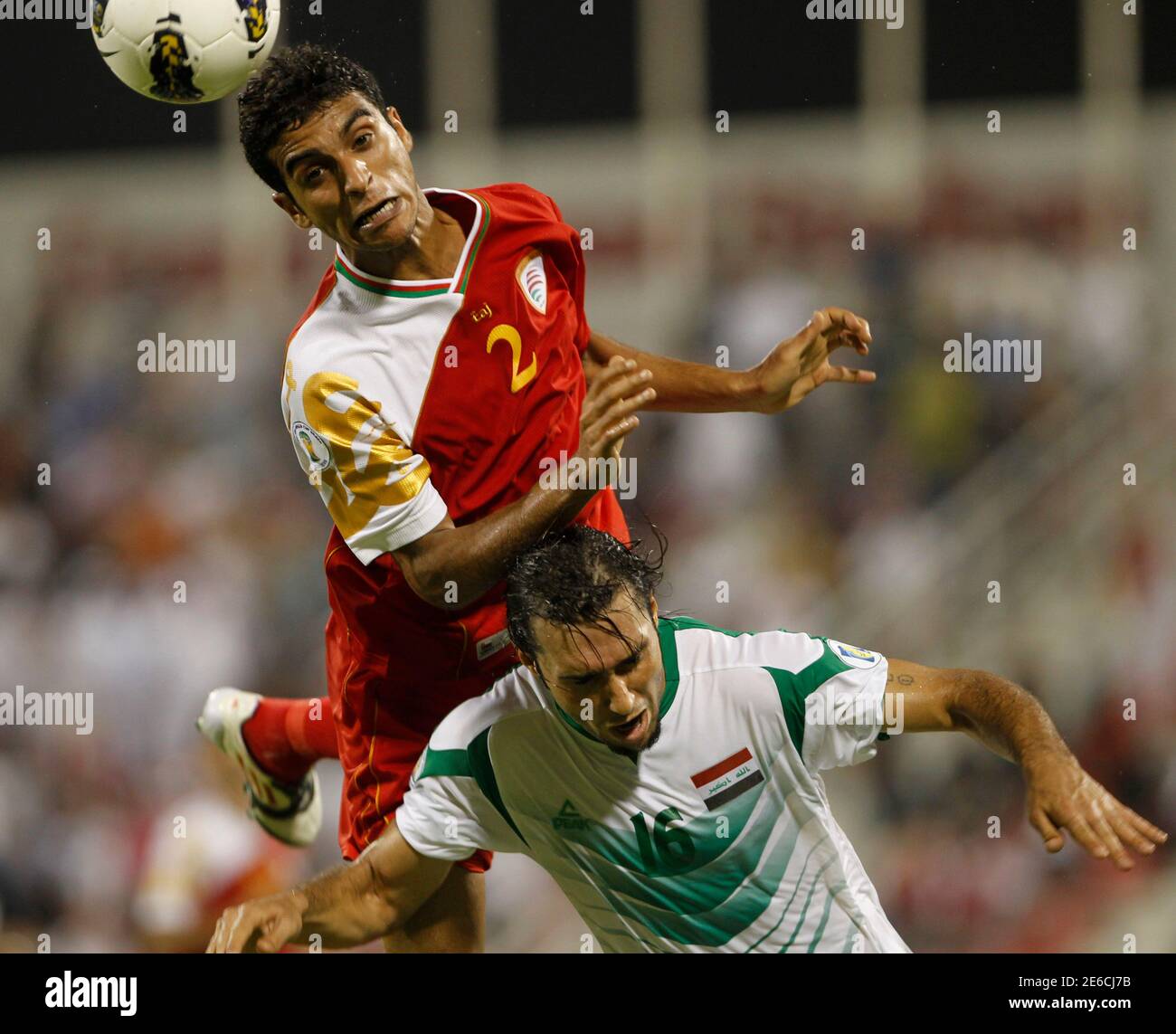Iraq S Samal Saeed Fights For The Ball With Mohamad Al Musallami Top Of Oman During Their