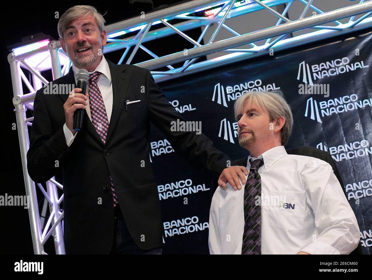 Danish scientist Henrik Scharfe (L) speaks next to his Geminoid-DK robot  during its presentation at the National Robotics Olympiad in San Jose  August 16, 2013. The Geminoid-DK is a tele-operated Android in