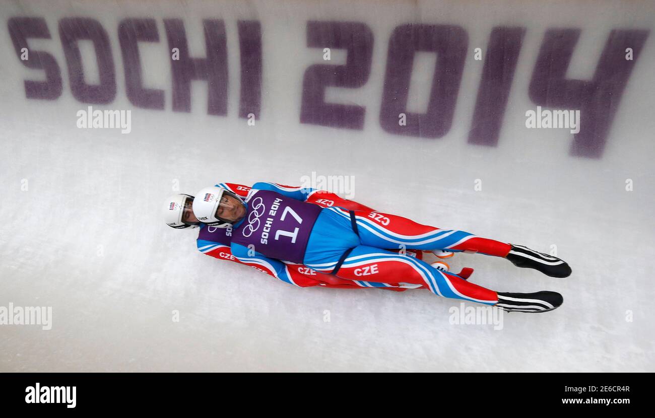 Lukas Broz and Antonin Broz of the Czech Republic speed down the track  during a men's doubles luge training session at the 2014 Sochi Winter  Olympics in the Sanki Sliding Center, Rosa