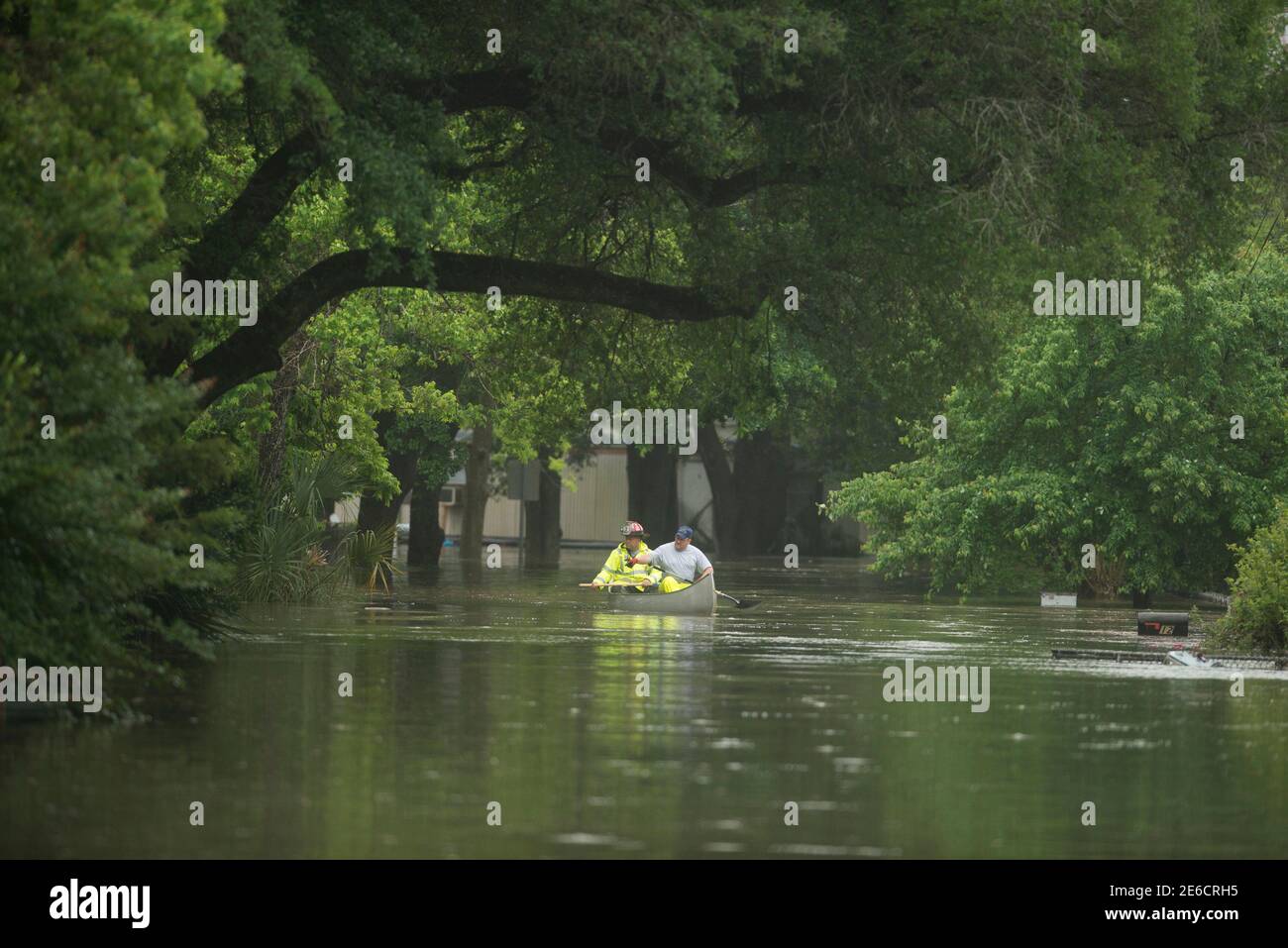 Fire Rescue personel look for residents along Kelly Ave. in Pensacola, Florida, April 30, 2014. A state of emergency was declared on Wednesday in Pensacola's Escambia County where emergency officials fought to save motorists stranded by flood waters. REUTERS/Michael Spooneybarger (UNITED STATES - Tags: ENVIRONMENT DISASTER) Stock Photo