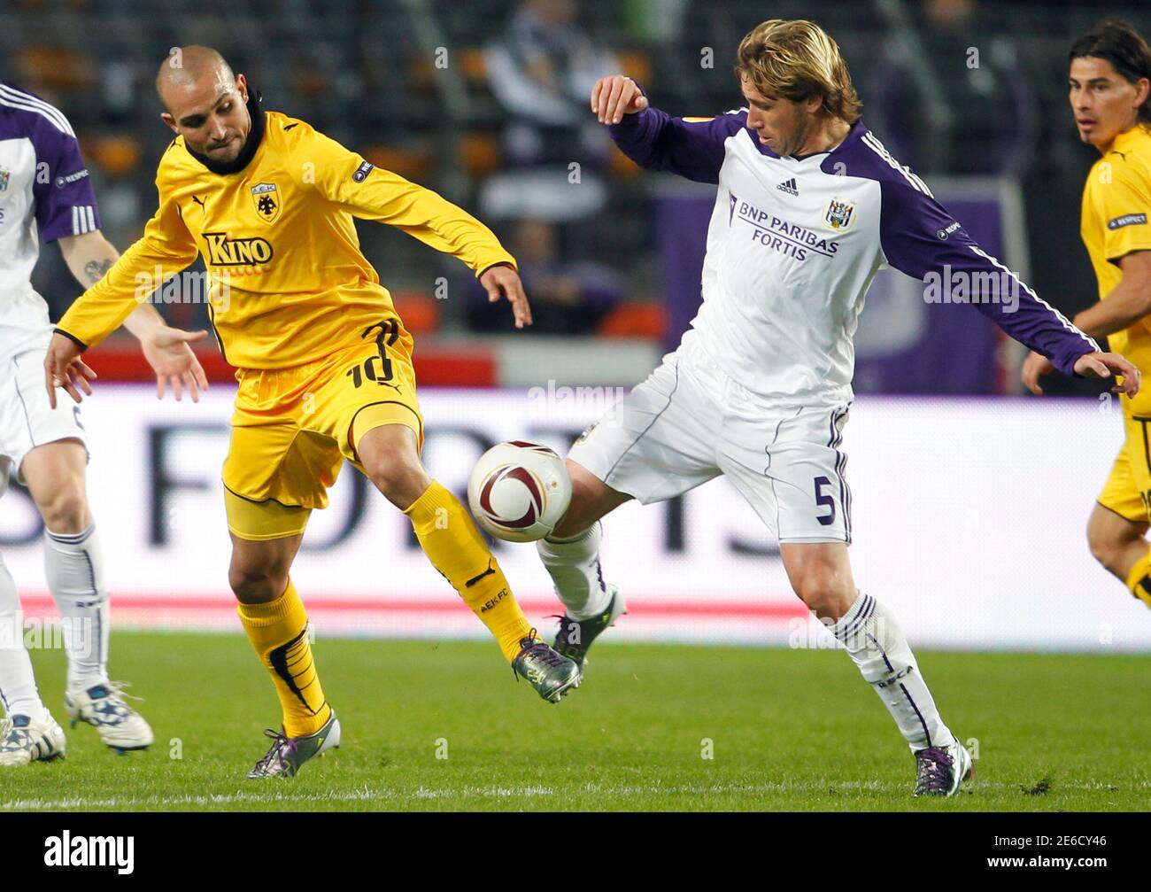 Anderlecht's Lucas Biglia (R) duels for the ball with AEK Athens' Rafik  Djebbour during their Europa League soccer match at the Constant Vanden  Stock stadium in Brussels October 21, 2010. REUTERS/Francois Lenoir (