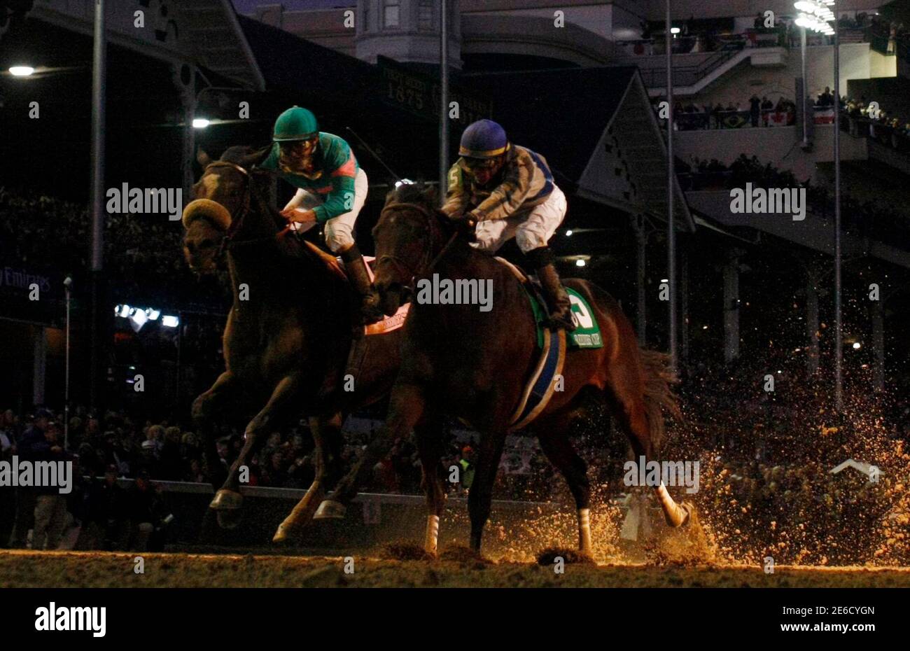 Jockey Garrett Gomez Rides Blame 5 To Edge Out Zenyatta L With Jockey Mike Smith Aboard In The Classic Race Under The Lights During The 10 Breeders Cup World Championships At Churchill