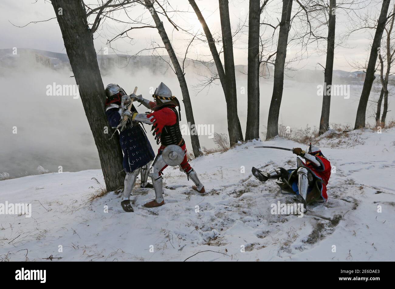 Members Of The Avalon Team Wearing 14th Century Knight Costumes Fight Against Each Other On The Bank Of The Yenisei River During The Regional Amateurs Tournament Of Clubs Of Historical Reconstruction The