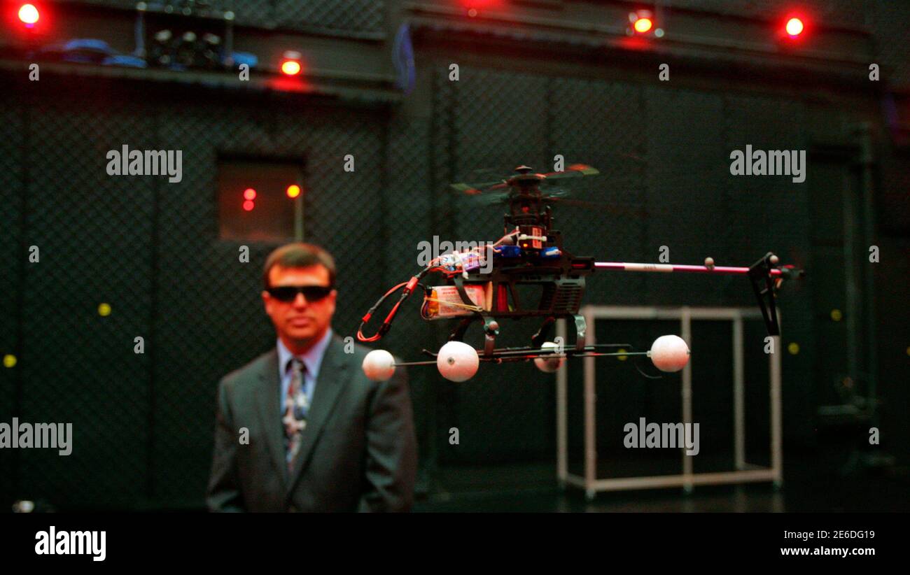 Dr. Gregory Parker, Micro Air Vehicle team leader, observes a computer
