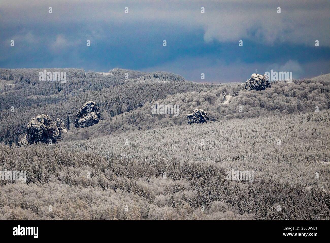 Aerial view of the rock formation Bruchhauser Steine a ground monument with four main rocks on the Istenberg in the Rothaargebirge in winter with snow Stock Photo
