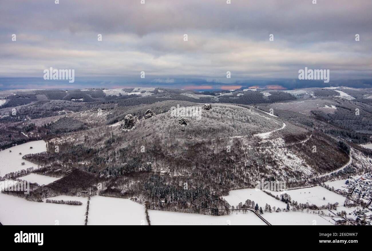 Aerial view of the rock formation Bruchhauser Steine a ground monument with four main rocks on the Istenberg in the Rothaargebirge in winter with snow Stock Photo