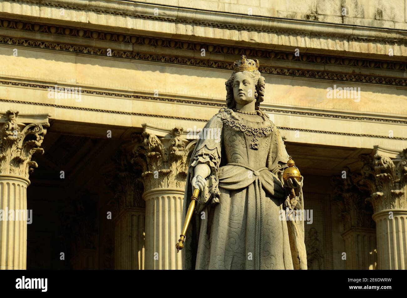 Statue of Queen Anne outside St Pauls Cathedral at sunset. Central