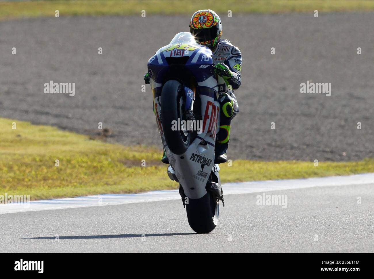 Yamaha Motogp Rider Valentino Rossi Of Italy Performs A Wheelie After The Qualifying Session For The Japanese Grand Prix In Motegi North Of Tokyo October 2 10 Reuters Toru Hanai Japan s