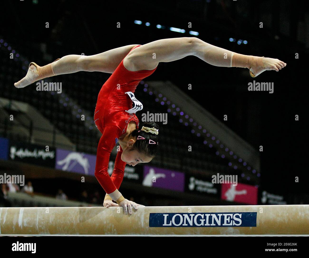 China's Huang Qiushuang performs on the beam during the women's artistic  Gymnastics World Championships at the Ahoy Arena in Rotterdam October 16,  2010. REUTERS/Jerry Lampen (NETHERLANDS - Tags: SPORT GYMNASTICS Stock  Photo - Alamy