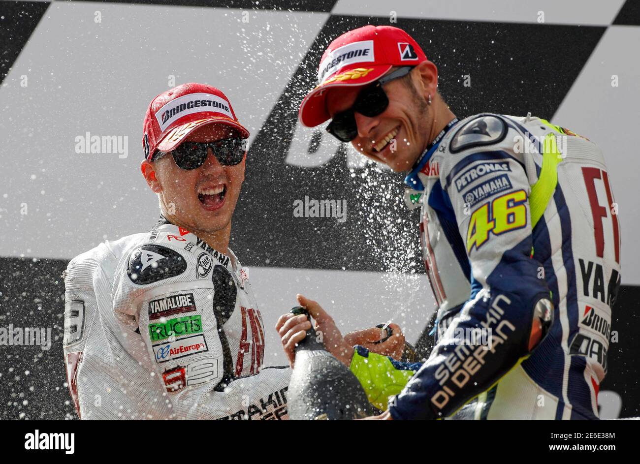 Yamaha Motogp Rider Jorge Lorenzo L Of Spain And Team Mate Valentino Rossi Of Italy Celebrate Their First And Second Places On The Podium At The Portuguese Grand Prix In Estoril October