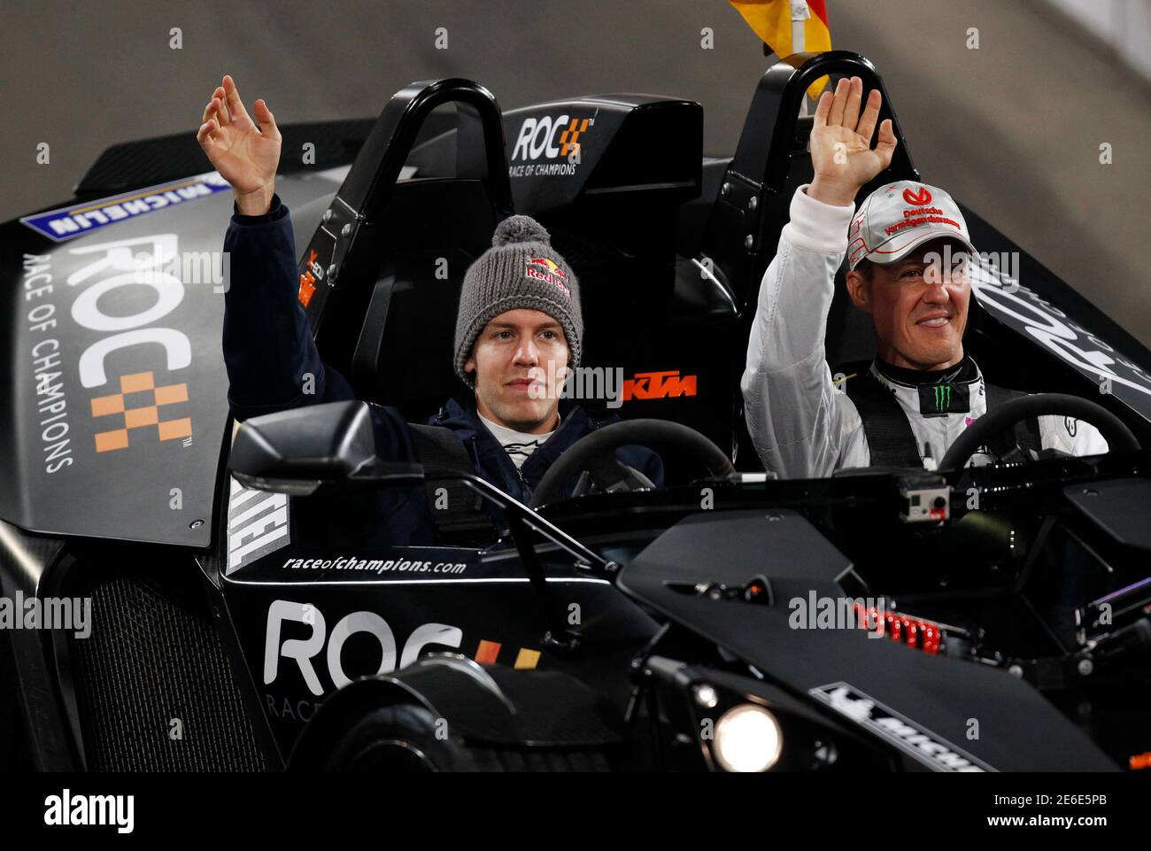 Formula One drivers Michael Schumacher (R) and Sebastian Vettel arrive for  the Race of Champions (ROC) at the Esprit Arena in Duesseldorf December 3,  2011. REUTERS/Alex Domanski (GERMANY - Tags: SPORT MOTORSPORT