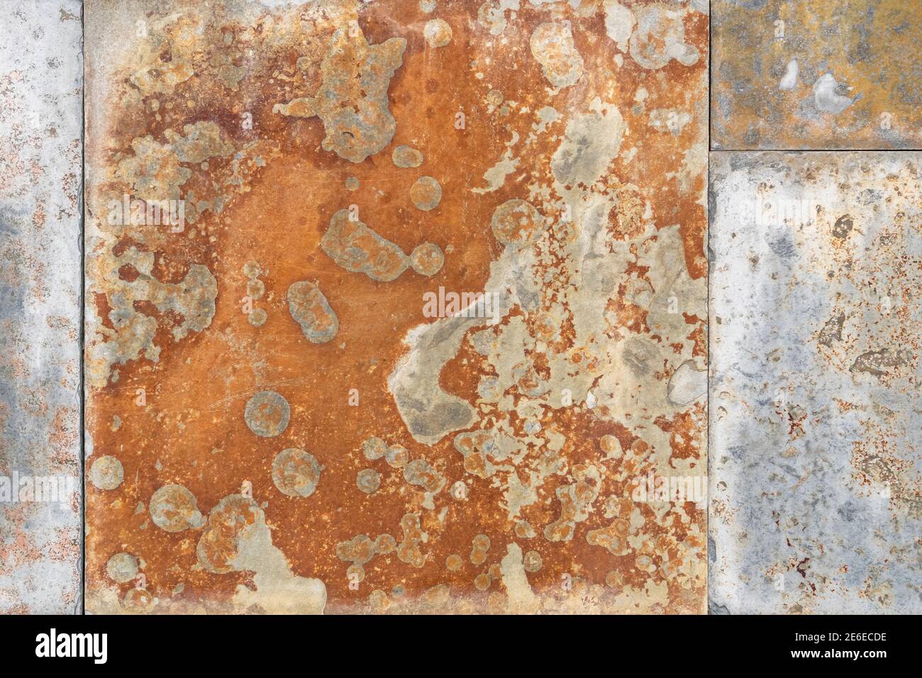 Rusty mottled peeling corroded texture. Abstract background Stock Photo