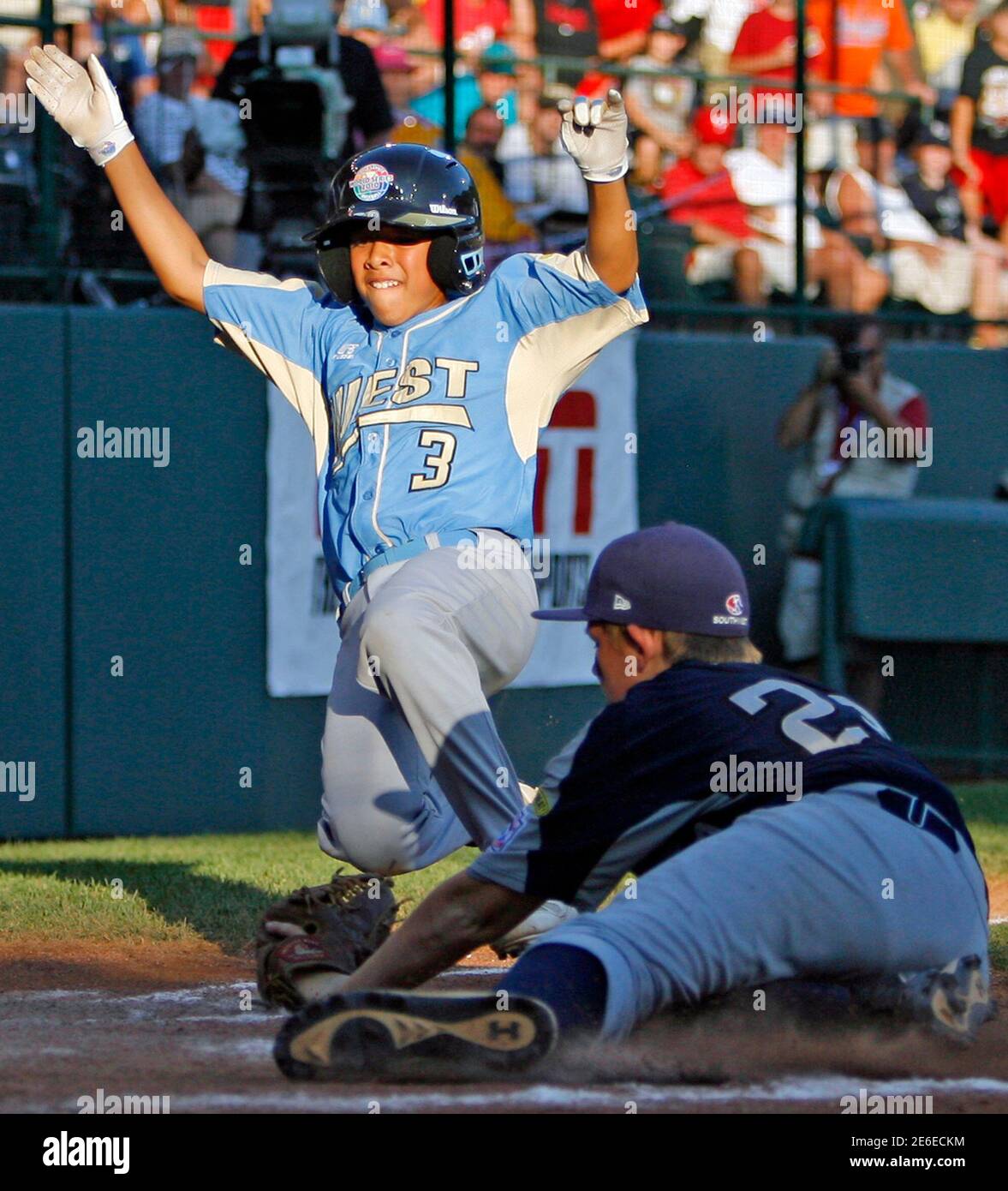 Waipahu Hawaii Player Ezra Heleski 3 Scores A Run Past Pearland Texas Pitcher Jaron Roblyer 22 On A Wild Pitch To End The Game During The Fifth Inning Of The Little League Waipahu Hawaii Player Ezra Heleski 3 Scores A Run Past Pearland Texas Pitcher Jaron Roblyer 22 On A Wild Pitch To End The Game During The Fifth Inning Of The Little League