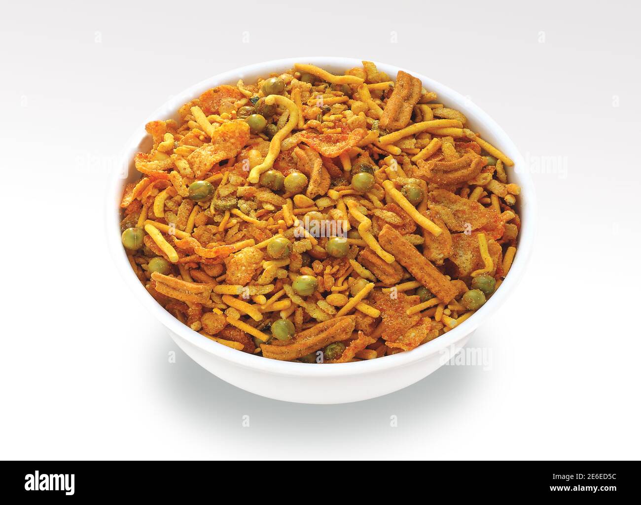 Indian Namkeen Snacks served in ceramic bowl & plate or Indian traditional Namkeen Food Mixture or Navratna Mix Namkeen Also Know as Nimco, Namkin, Mi Stock Photo