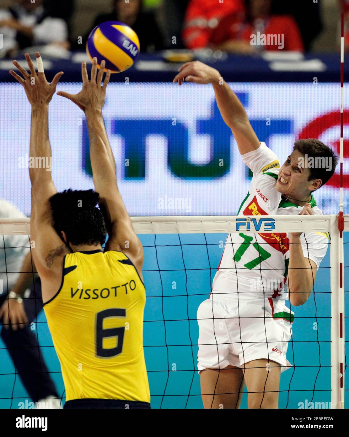 Nikolay Penchev of Bulgaria (R) spikes the ball against Leandro Vissotto  Neves of Brazil during their FIVB Men's Volleyball World Championship  second round match in Ancona October 2, 2010. REUTERS/Giampiero Sposito  (ITALY -