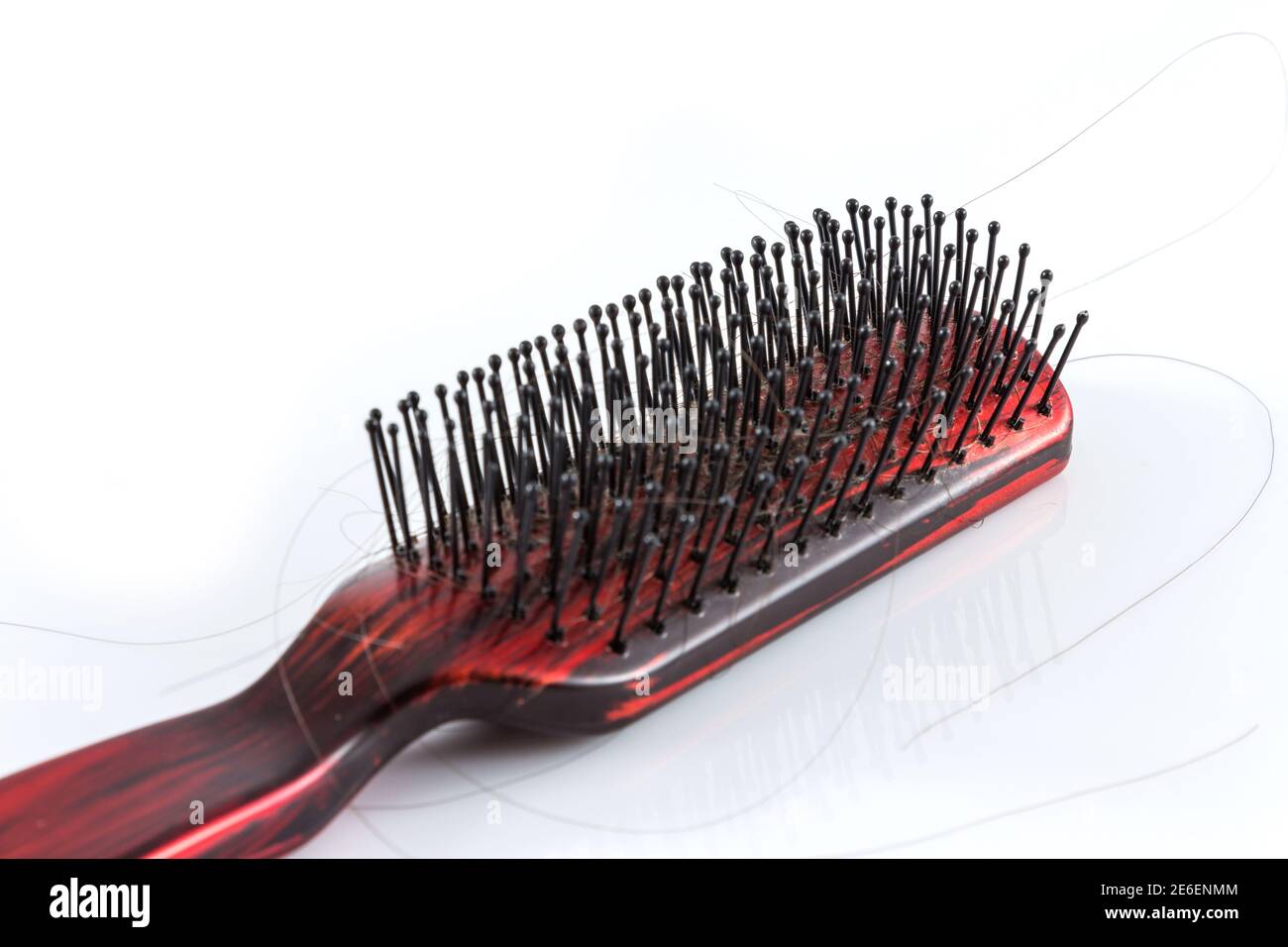 Comb and hair on white background Stock Photo
