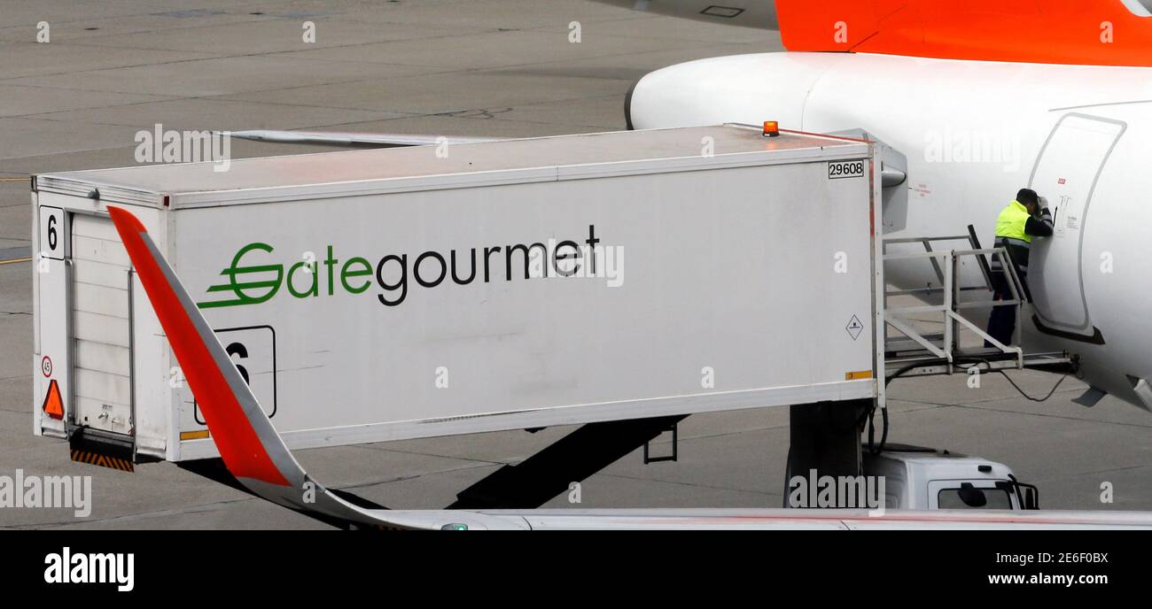 A Gate Gourmet Staff Part Of Swiss Airline Catering Firm Gategroup Holdings Looks Inside An Easyjet Commercial Airplane At Cointrin Airport In Geneva Switzerland April 13 16 Picture Taken Through A Window