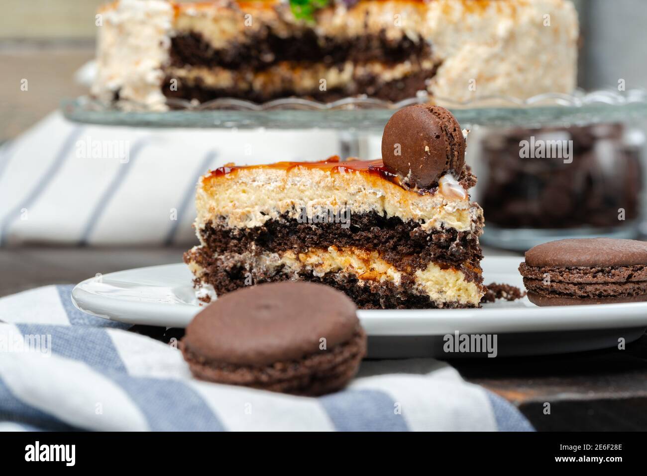 Chocolate cake with whipped cream icing on plate Stock Photo - Alamy