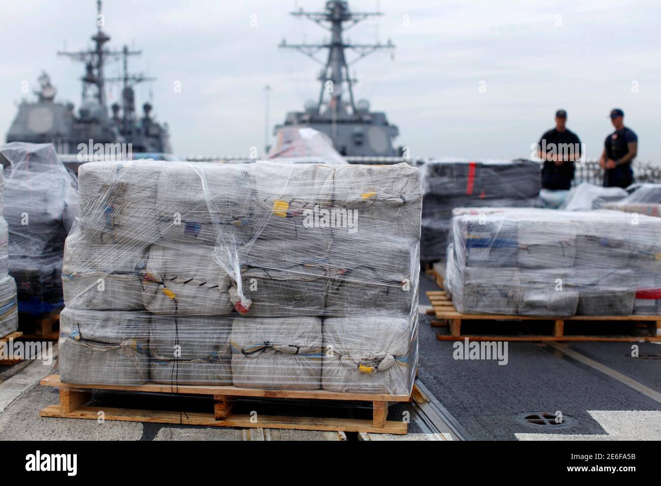 Armed U.S. Coast Guardsmen aboard the Coast Guard Cutter Waesche stand watch as more than 39,000 pounds of seized cocaine is offloaded at Naval Base San Diego, California, U.S.,  October 27, 2016.     REUTERS/Mike Blake Stock Photo