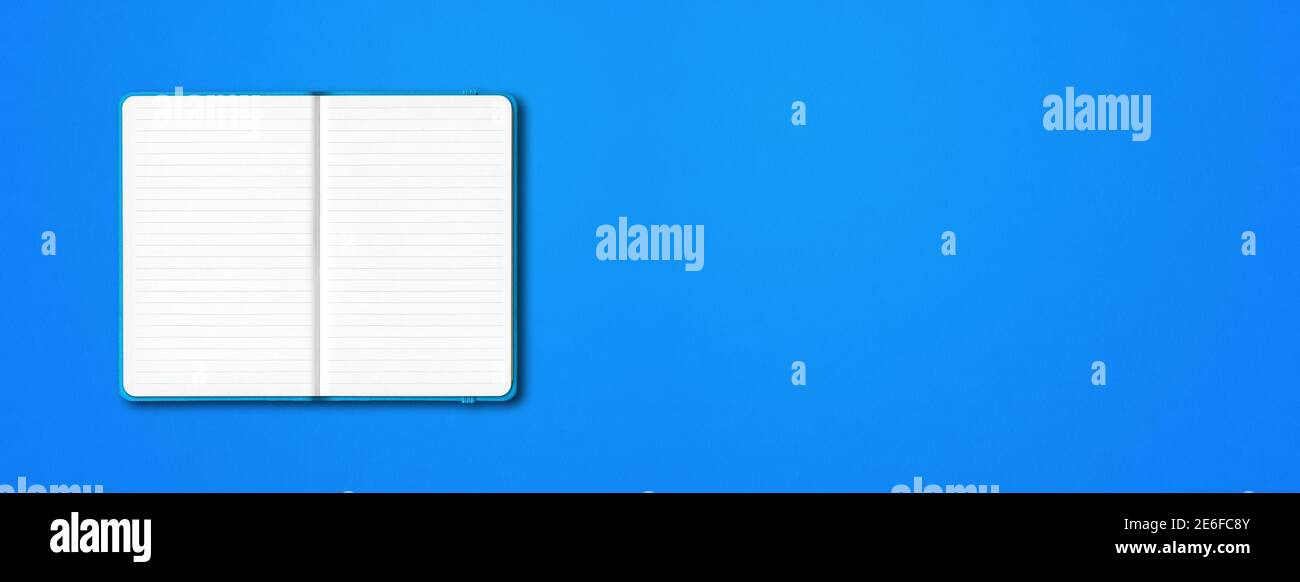Cyan open lined notebook mockup isolated on blue background. Horizontal banner Stock Photo