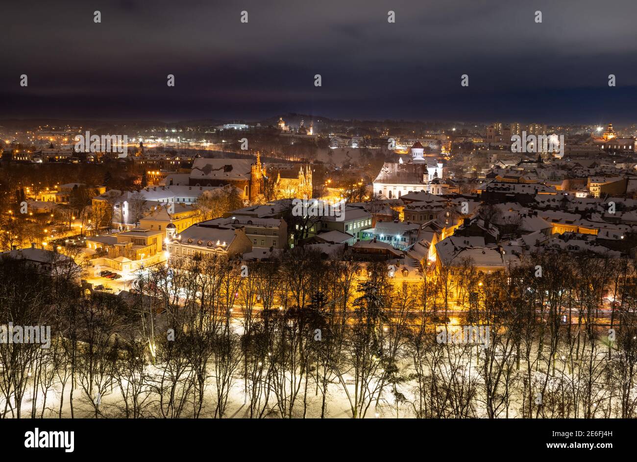Aerial view of Vilnius old town, Lithuania in winter night with snow